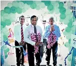  ??  ?? Cutting the ribbon to inaugurate the new Softlogic Finance Gampaha branch . From left: Chairman Ashok Pathirage, Deputy Chairman Harris Premaratne and CEO Nalin Wijekoon