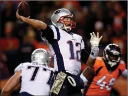  ?? The Associated Press ?? WINNING WAYS: New England Patriots quarterbac­k Tom Brady (12) throws as Denver Broncos outside linebacker Shaquil Barrett (48) pursues during the second half of Sunday’s game in Denver. The win marked the first back-to-back wins for the Patriots in...