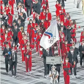  ?? AFP ?? Sin bandera.
Así desfilaron los rusos en la ceremonia de Tokio 2020.