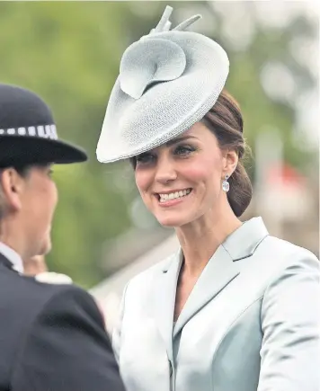  ??  ?? The Duchess of Cambridge talks to guests during the first garden party of the season at Buckingham Palace