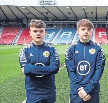  ?? ?? SCOT THE LOT: Michael, second left, at Hampden with fellow Scottish players in