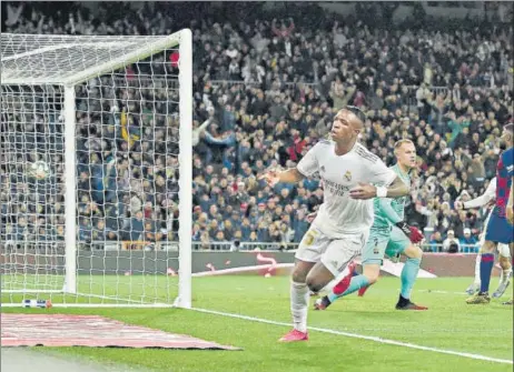  ?? AFP ?? Real Madrid's Brazilian forward Vinicius Junior (centre) celebrates after scoring a goal against Barcelona during their La Liga clash at the Bernabeu Stadium on Sunday.