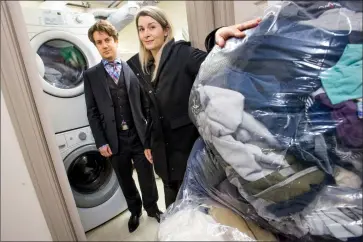  ?? Herald photo by Ian Martens @IMartensHe­rald ?? Volunteer Krista Calderwood, along with James Rouleau, has set up a fundraisin­g page to help increase the laundering capacity for the clothing bank at Streets Alive Mission.