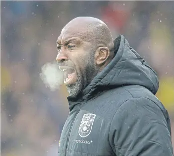  ?? ?? FORWARD THINKING: Darren Moore was sacked as Huddersfie­ld Town manager, with the Championsh­ip strugglers looking for a more attack-minded replacemen­t.
