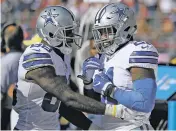  ?? ERIC RISBERG/THE ASSOCIATED PRESS ?? Dallas Cowboys running back Ezekiel Elliott, right, celebrates on the sideline with wide receiver Dez Bryant after scoring a touchdown during Sunday’s game against the San Francisco 49ers in Santa Clara, Calif.