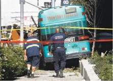  ?? Paul Chinn / The Chronicle ?? Police investigat­e a traffic collision involving two AC Transit buses and at least one passenger vehicle in San Francisco.