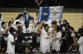  ?? DARRON CUMMINGS — THE ASSOCIATED PRESS ?? Cleveland State’s Algevon Eichelberg­er celebrates with teammates after the Vikings won the Horizon League conference tournament championsh­ip game March 9.