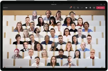  ??  ?? Together Mode in Microsoft Teams puts video meeting participan­ts in a virtual setting designed to make meetings more engaging. It’s just a drop in the deluge of features Microsoft is rolling out for Teams.