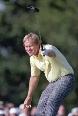  ?? THE ASSOCIATED PRESS ?? FILE - In this Sunday, April 13, 1986, file photo, Jack Nicklaus watches his shot go for a birdie on the 17th at the Masters golf tournament in Augusta, Ga. Curtis Strange says every player who finished stayed in the locker room to watch the...