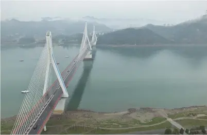  ??  ?? Mist on the Yangtze River in Yichang City in central China’s Hubei Province yesterday. — CFP