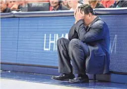  ?? CASEY SAPIO/USA TODAY ?? Arizona Wildcats head coach Sean Miller sits with his head in his hands during the second half against Oregon on Jan. 13 at McKale Center.