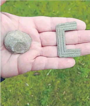  ?? ?? HISTORIC FIND: Archaeolog­ists found a shoe buckle and grapeshot.