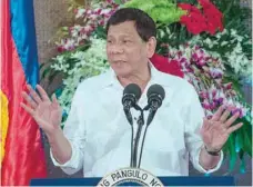  ?? — AFP ?? Philippine President Rodrigo Duterte gives a speech during Eid al Fitr celebratio­ns at the Malacanang Palace in Manila, on Tuesday.