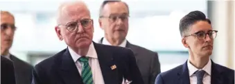  ??  ?? Flanked by his attorneys, Ald. Ed Burke (14th) walks out of the Dirksen Federal Courthouse on June 4, 2019.