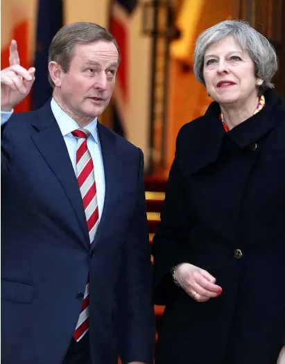  ??  ?? DELUDED: British PM Theresa May with Taoiseach Enda Kenny in Dublin last week. Photo: Gerry Mooney