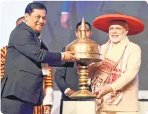  ??  ?? Prime Minister Narendra Modi being felicitate­d by Assam Chief Minister Sarbananda Sonowal during the inaugurati­on of Advantage Assam programme at Indira Gandhi Athletic Stadium, in Guwahati on Saturday.