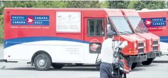  ?? RYAN REMIORZ/CP FILES ?? The Canadian Union of Postal Workers says its plan to begin a rolling overtime ban at midnight Sunday has been placed on hold for 24 hours.CUPW issued a statement late Sunday night that it was delaying any possible job action in a “last ditch effort”...