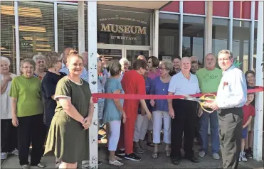  ?? / Contribute­d ?? The Polk County Chamber of Commerce joined members of the Polk County Historical Society for a ribbon cutting ceremony at the new museum location at 117 West Ave., Cedartown.