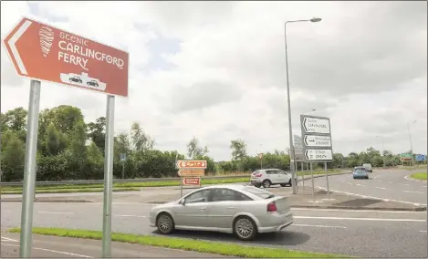  ??  ?? Carlingfor­d Ferry sign at the Ballymasca­nlon roundabout.