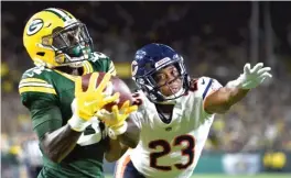  ?? STACY REVERE/GETTY IMAGES ?? Packers receiver Geronimo Allison hauls in a 39-yard touchdown pass behind Bears cornerback Kyle Fuller in the fourth quarter Sunday.