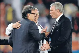  ?? Photo: REUTERS ?? Those were the days: Paraguay’s coach Gerardo Martino, left, shakes the hand of All Whites coach Ricki Herbert after their 2010 World Cup socer match in Polokwane, South Africa, June 24, 2010.