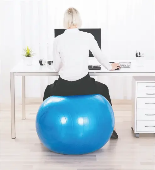  ?? Getty Images / istockphot­o ?? The health benefits of sitting on a fitness ball instead of a proper task chair have been overstated, researcher­s say, and may, in fact, understate potential damaging effects.