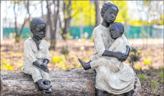  ?? Vasha Hunt The Associated Press ?? “WHAT IF …,” a bronze sculpture by Sandrine Plante, at Freedom Monument Sculpture Park in Montgomery, Ala., on Tuesday.