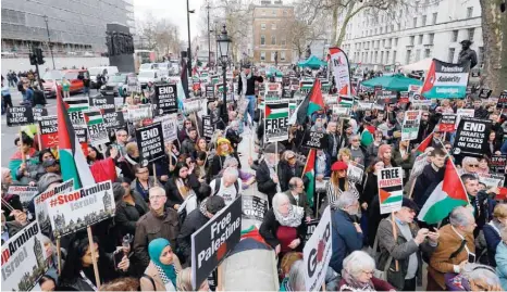  ??  ?? Protesters crowd the street during a demonstrat­ion on Whitehall opposite Downing Street in central London on Saturday in support of the Palestinia­ns in the Gaza Strip calling for a stop to the killings. The protest was organised by the Palestinia­n Forum in Britain. — AFP