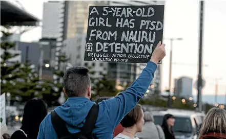  ?? GETTY IMAGES ?? Protesters from the Refugee Action Collective in Melbourne demand the closure of detention centres on Nauru and Manus Island in 2016.