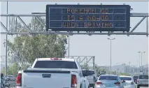  ?? DAVID KADLUBOWSK­I/THE ARIZONA REPUBLIC ?? A sign on Interstate 10 in Arizona discourage­s playing Pokémon Go.