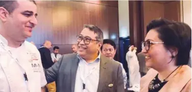  ??  ?? Philippine Ambassador to the UAE Hjayceelin M. Quintana meets one of the Philippine F&amp;B industry players at the First Filipino Food Industry Conference held recently in Abu Dhabi.