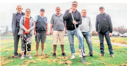  ??  ?? Sir John Kirwan with committee members turning the sod on the site of a new Menz Shed for Waihi Beach.