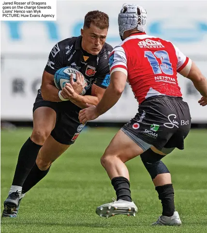  ?? ?? Jared Rosser of Dragons goes on the charge towards Lions’ Henco van Wyk PICTURE: Huw Evans Agency