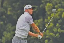  ?? AP PHOTO/JEFF CHIU ?? Dustin Johnson watches his tee shot on the 12th hole at TPC Harding Park during the third round of the PGA Championsh­ip on Saturday in San Francisco.