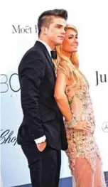  ??  ?? US heiress and model Paris Hilton (left) and her partner River Viiperi pose.