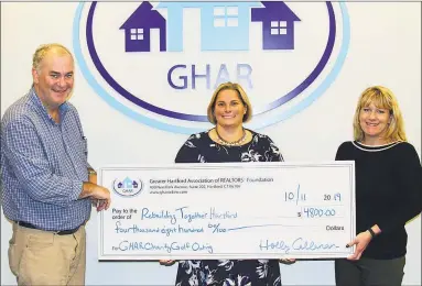  ?? Contribute­d photo ?? GHAR members raised thousands during their September golf tournament, and donated the proceeds to Rebuilding Together.