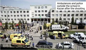  ??  ?? Ambulances and police outside the school in Kazan after the shooting