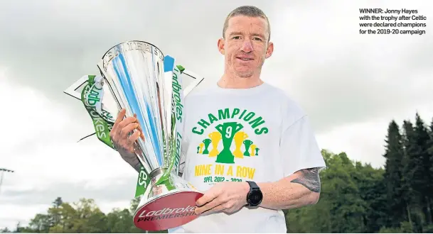  ??  ?? WINNER: Jonny Hayes with the trophy after Celtic were declared champions for the 2019-20 campaign