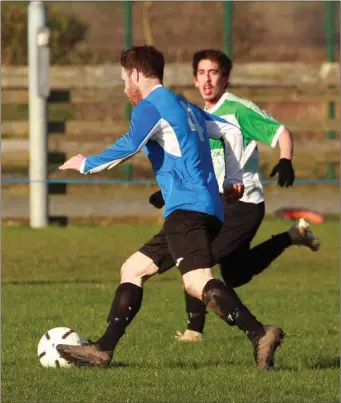  ??  ?? Colum Kinsella of Courtown Hibs is tracked by Marco Santos of Gorey Celtic during their Creane and Creane Wexford Cup second round match on Sunday.