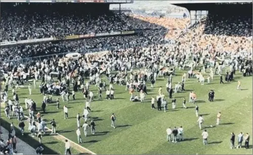  ??  ?? ORDEAL: People spill on to the pitch at Hillsborou­gh as the disaster unfolds in the Leppings Lane end of the stadium. More than 28 years later, criminal charges have been brought.