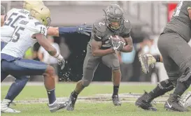  ?? PHELAN M. EBENHACK/AP ?? UCF and running back Otis Anderson could make it 23 wins in a row with a victory over Cincinnati in what could be one of the best games of the year.