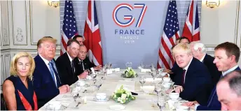  ?? — AFP photo ?? Trump (second left) and Johnson (third right) attend a working breakfast in Biarritz, south-west France, on the second day of the annual G7 Summit attended by the leaders of the world’s seven richest democracie­s, Britain, Canada, France, Germany, Italy, Japan and the United States.