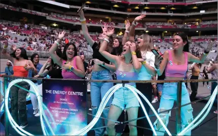  ?? ?? Fans dance during the May 12Coldplay show, which, in addition to stationary bikes, had dance floors that generated power via users’ movements.