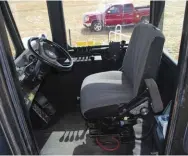 ??  ??  The inside of the Cruiser Cab is a nice place to work. Heat, AC, suspended seat, good soundproof­ing, great visibility, tilt steering, good control layout, and even a reasonably comfortabl­e jump seat for company.