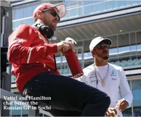  ??  ?? Vettel and Hamilton chat before the Russian GP in Sochi