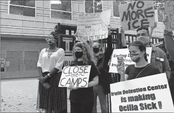  ?? PRESS FILE PHOTO] ?? In this Tuesday photo, Dawn Wooten, left, a nurse at Irwin County Detention Center in Ocilla, Georgia, speaks at a news conference in Atlanta protesting conditions at the immigratio­n jail. [JEFF AMY/ASSOCIATED