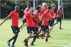  ?? AP ?? United States team limbering up during a training session ahead of the crucial qualifier against Panama.