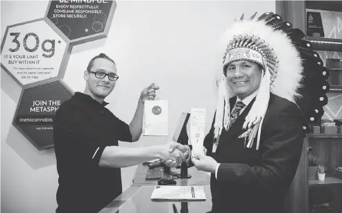  ?? JORDAN POPOWICH ?? Onekanew (Chief ) Christian Sinclair, right, of Opaskwayak Cree Nation says investing in a legal pot producer has been a game-changer.