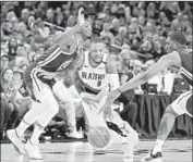  ?? Craig Mitchelldy­er Associated Press ?? PORTLAND’S Damian Lillard is pressured by Golden State’s Alfonzo McKinnie, left, and Kevon Looney.