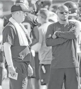  ?? Brett Coomer / Houston Chronicle ?? Texans coach Bill O’Brien, left, likes how offseason conversati­ons with general manager Rick Smith are shaping up regarding the vision for the team.